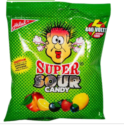 Green package of Super Sour Candy with cartoon character and fruit icons on a white background